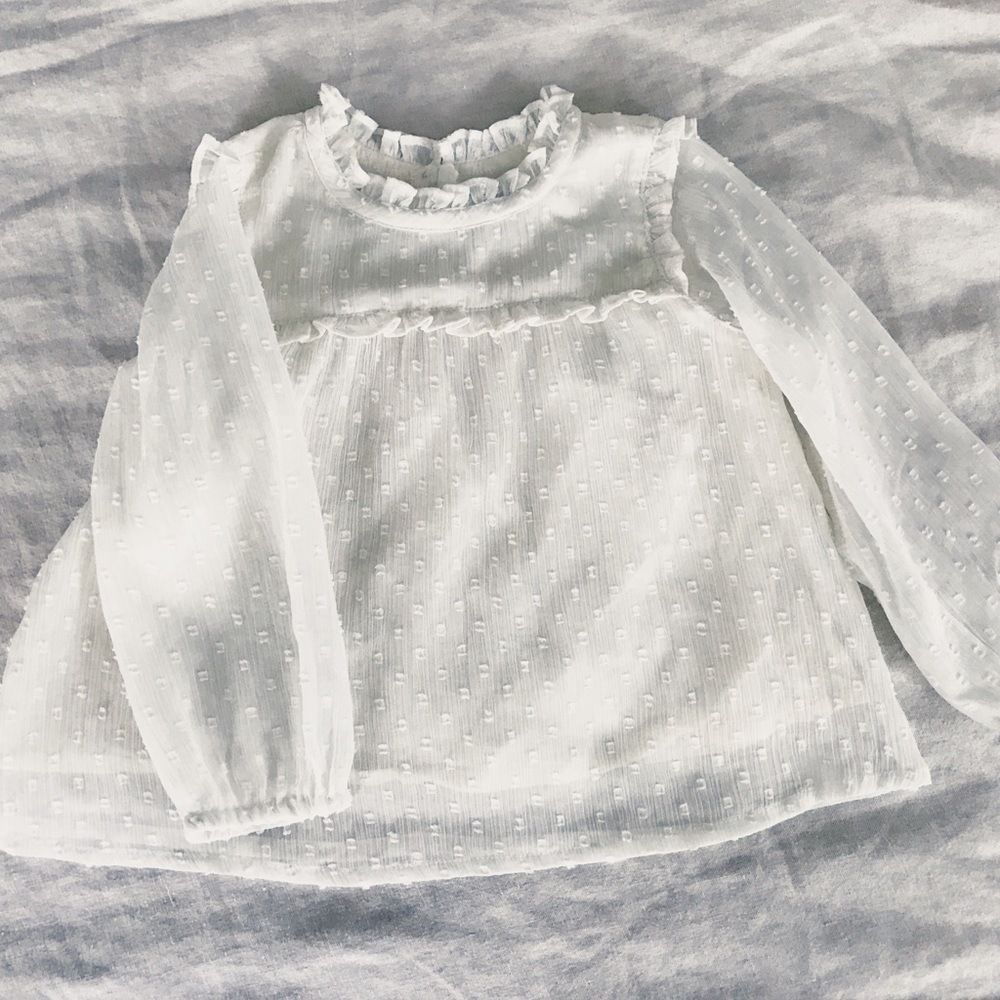 White ruffle blouse